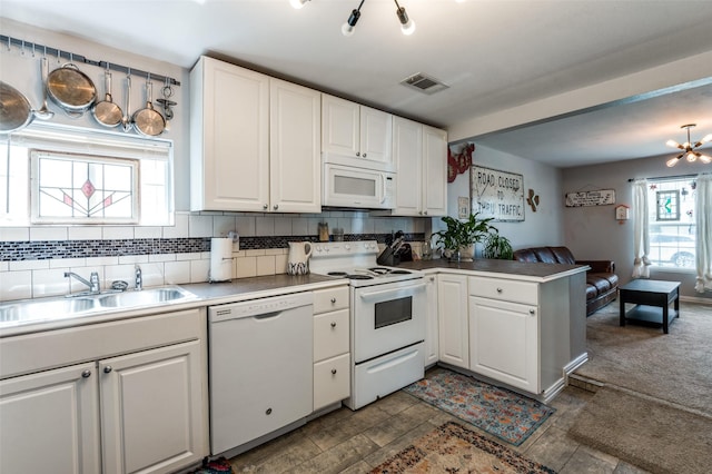 1103 1st Ave, Mckinney, TX 75069 - kitchen with white appliances, a peninsula, white cabinets, and plenty of natural light