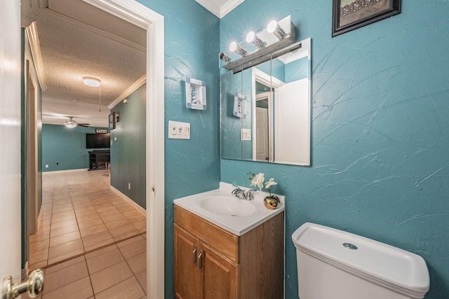 713 Keystone St, Mesquite, TX 75149 - half bathroom featuring ornamental molding, vanity, tile patterned floors, a ceiling fan, and a textured ceiling