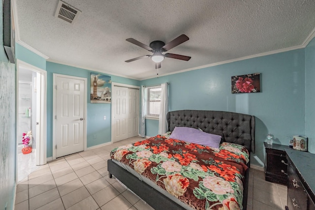 713 Keystone St, Mesquite, TX 75149 - bedroom with crown molding, tile patterned flooring, a closet, ceiling fan, and a textured ceiling