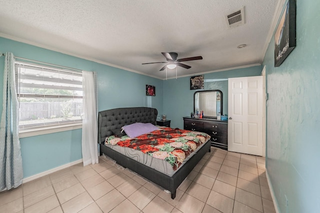 713 Keystone St, Mesquite, TX 75149 - bedroom with ornamental molding, a textured ceiling, light tile patterned flooring, and a ceiling fan