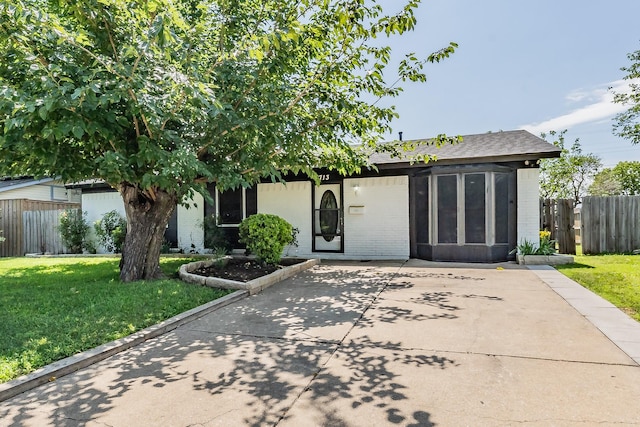 713 Keystone St, Mesquite, TX 75149 - view of front of house featuring brick siding and roof with shingles