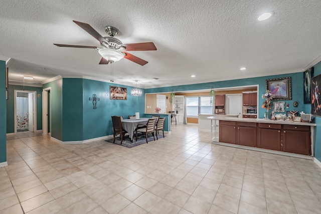 713 Keystone St, Mesquite, TX 75149 - kitchen with a textured ceiling, a ceiling fan, ornamental molding, a peninsula, and light countertops