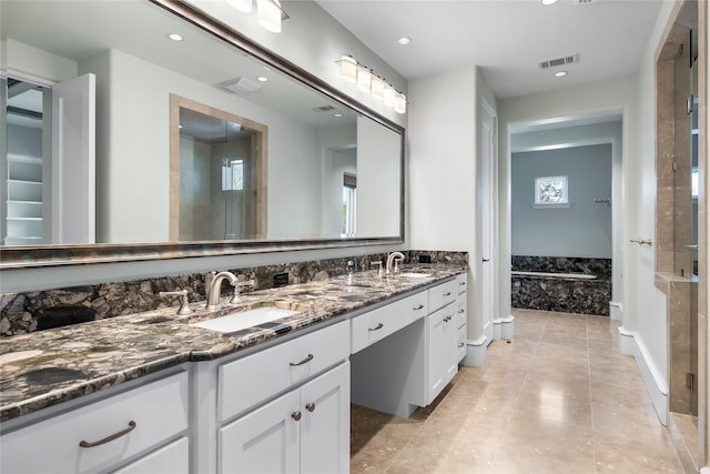 3619 Harvard Ave, Highland Park, TX 75205 - bathroom with double vanity, recessed lighting, a stall shower, tile patterned floors, and a bathtub