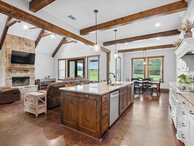 3628 S Fm 1655, Chico, TX 76431 - kitchen with stainless steel dishwasher, finished concrete floors, beamed ceiling, white cabinetry, and open floor plan