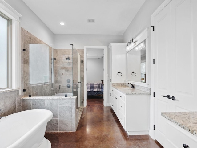 3628 S Fm 1655, Chico, TX 76431 - full bathroom featuring a stall shower, a freestanding bath, vanity, finished concrete floors, and recessed lighting