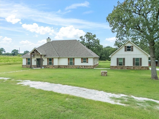 3628 S Fm 1655, Chico, TX 76431 - modern farmhouse style home with board and batten siding, a front lawn, a shingled roof, and a chimney