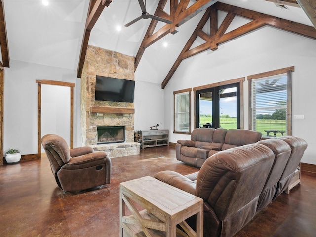 3628 S Fm 1655, Chico, TX 76431 - living area featuring concrete flooring, high vaulted ceiling, beamed ceiling, a stone fireplace, and recessed lighting
