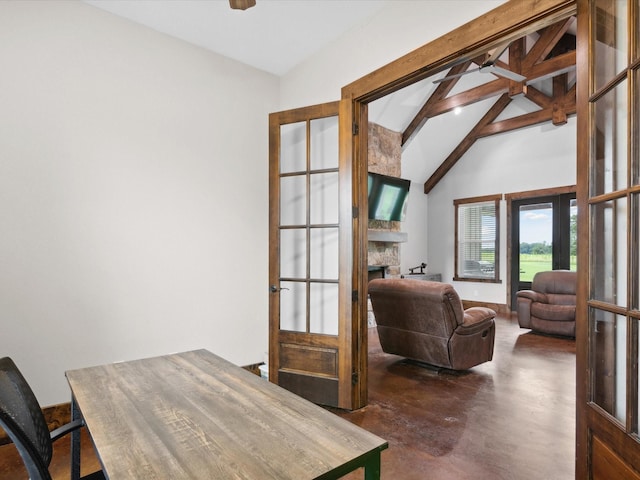 3628 S Fm 1655, Chico, TX 76431 - office area featuring concrete flooring, a stone fireplace, high vaulted ceiling, and beamed ceiling