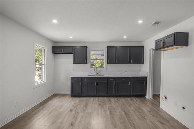 8208 Kender Ln, White Settlement, TX 76108 - kitchen featuring light wood finished floors, light countertops, and recessed lighting