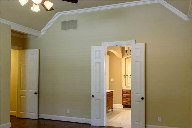11819 Coronado Trl, Frisco, TX 75033 - unfurnished bedroom with lofted ceiling, arched walkways, ornamental molding, ceiling fan, and wood finished floors