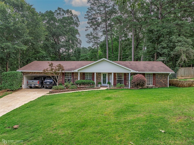 1112 Franklin St, Minden, LA 71055 - ranch-style house featuring driveway, an attached carport, brick siding, and a porch