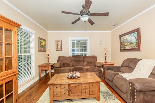 1401 W Shepherd St, Denison, TX 75020 - living room with light wood finished floors, crown molding, a ceiling fan, and healthy amount of natural light