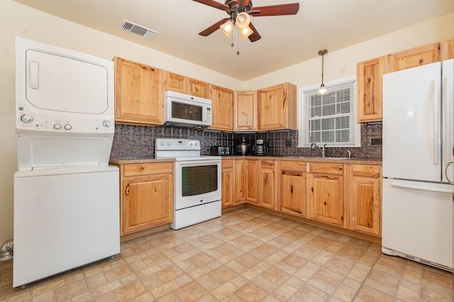 1401 W Shepherd St, Denison, TX 75020 - kitchen with white appliances, estacked washer and dryer, a ceiling fan, and decorative backsplash