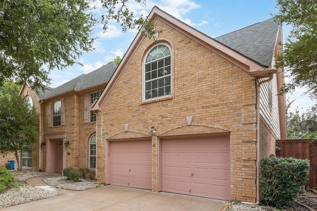1907 New Haven Rd, Grapevine, TX 76051 - view of front of property with an attached garage, brick siding, a shingled roof, and driveway