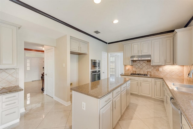 1907 New Haven Rd, Grapevine, TX 76051 - kitchen featuring stainless steel appliances, tasteful backsplash, under cabinet range hood, light stone counters, and recessed lighting