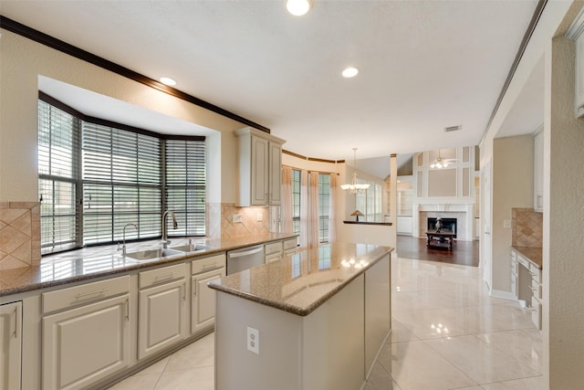 1907 New Haven Rd, Grapevine, TX 76051 - kitchen with a center island, decorative backsplash, a chandelier, light stone countertops, and open floor plan