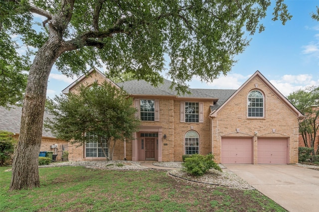 1907 New Haven Rd, Grapevine, TX 76051 - view of front of property featuring driveway, an attached garage, a shingled roof, brick siding, and a front yard