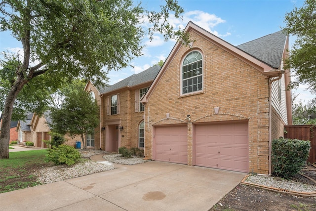 1907 New Haven Rd, Grapevine, TX 76051 - view of front of home with a garage, brick siding, concrete driveway, and roof with shingles