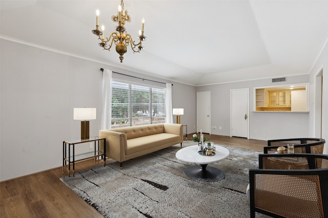 6325 Bandera Ave Unit C, Dallas, TX 75225 - living area featuring wood finished floors, a chandelier, a tray ceiling, and ornamental molding