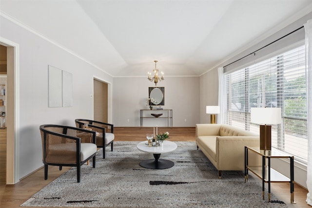 6325 Bandera Ave Unit C, Dallas, TX 75225 - sitting room with vaulted ceiling, wood finished floors, a chandelier, and crown molding