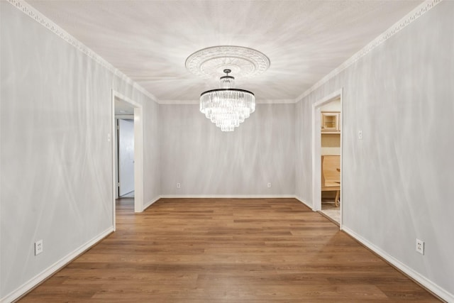 6325 Bandera Ave Unit C, Dallas, TX 75225 - unfurnished dining area with crown molding, a chandelier, and wood finished floors