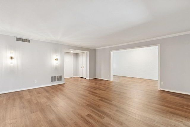 6325 Bandera Ave Unit C, Dallas, TX 75225 - unfurnished room with ornamental molding and light wood-style flooring