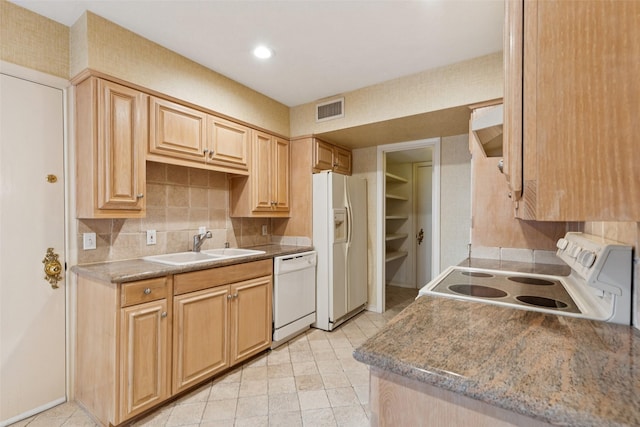 6325 Bandera Ave Unit C, Dallas, TX 75225 - kitchen with white appliances, backsplash, and light tile patterned floors