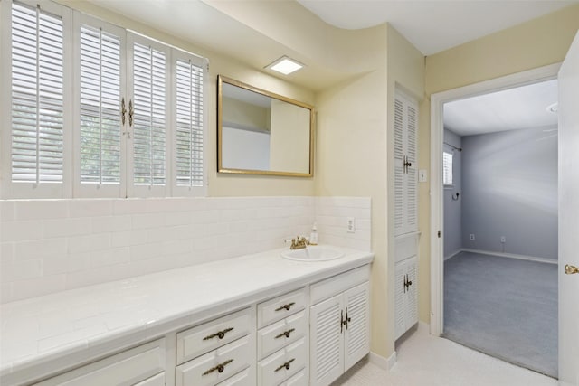 6325 Bandera Ave Unit C, Dallas, TX 75225 - bathroom featuring vanity and tasteful backsplash