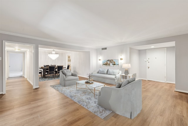 6325 Bandera Ave Unit C, Dallas, TX 75225 - living room with light wood-style floors and ornamental molding