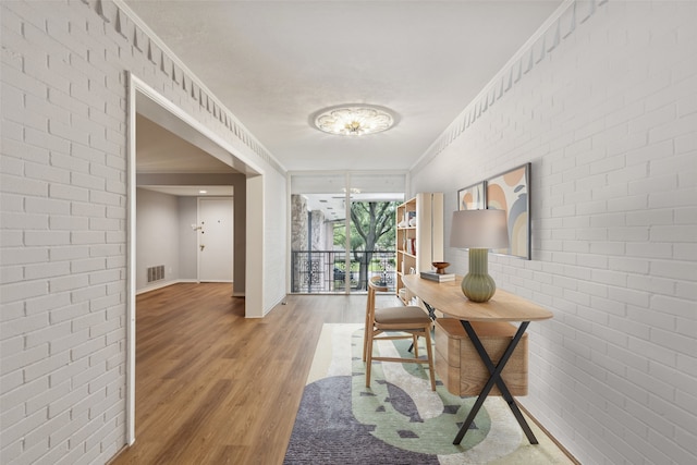 6325 Bandera Ave Unit C, Dallas, TX 75225 - office space featuring light wood-style flooring and brick wall
