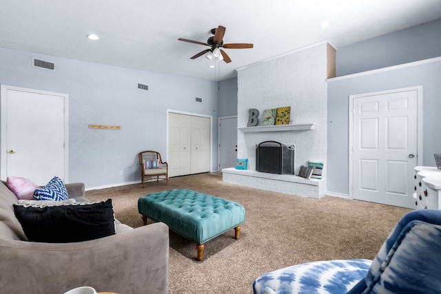 2318 Holsum Cir, Greenville, TX 75401 - carpeted living area with a ceiling fan, a brick fireplace, and recessed lighting