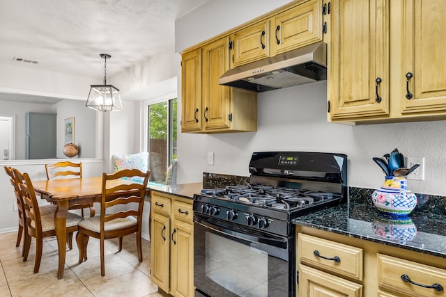 1638 Glencairn Ln, Lewisville, TX 75067 - kitchen featuring black gas range, under cabinet range hood, light tile patterned floors, dark stone countertops, and pendant lighting