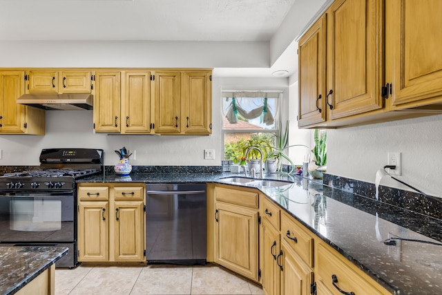 1638 Glencairn Ln, Lewisville, TX 75067 - kitchen with stainless steel dishwasher, black range with gas stovetop, under cabinet range hood, dark stone counters, and light tile patterned flooring