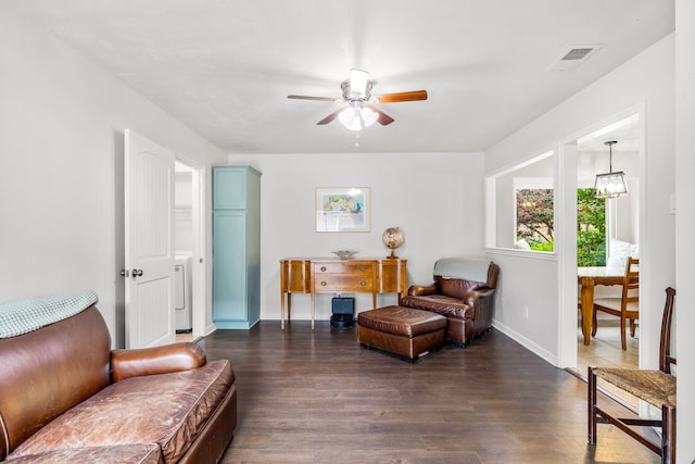 1638 Glencairn Ln, Lewisville, TX 75067 - living area featuring ceiling fan and dark wood-style floors