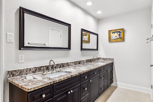 1638 Glencairn Ln, Lewisville, TX 75067 - full bath with double vanity, tile patterned flooring, and recessed lighting