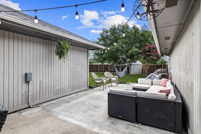 1638 Glencairn Ln, Lewisville, TX 75067 - fenced backyard with outdoor lounge area, a patio area, and a storage unit