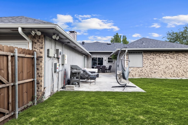 1638 Glencairn Ln, Lewisville, TX 75067 - rear view of house with a patio, a shingled roof, and a chimney