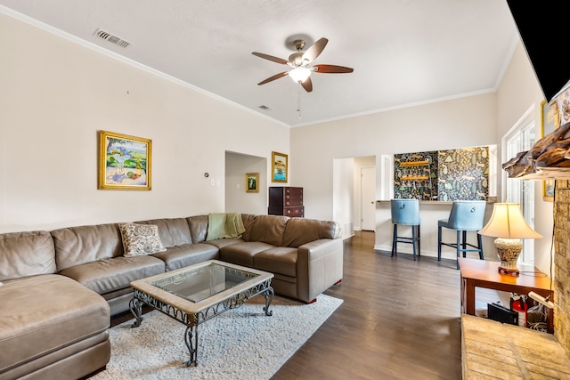1638 Glencairn Ln, Lewisville, TX 75067 - living room with a ceiling fan, dark wood-style floors, crown molding, and a dry bar