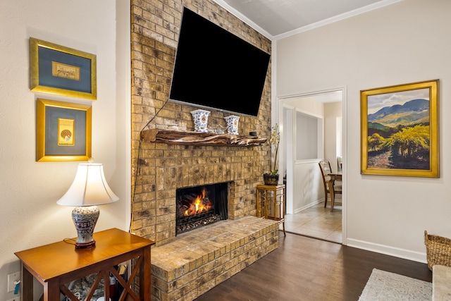 1638 Glencairn Ln, Lewisville, TX 75067 - living area with wood finished floors, a fireplace, and ornamental molding
