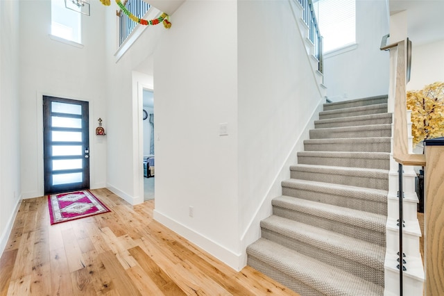 4017 Prickly Pear Ave, Aubrey, TX 76227 - entryway featuring light wood-type flooring, healthy amount of natural light, stairs, and a high ceiling