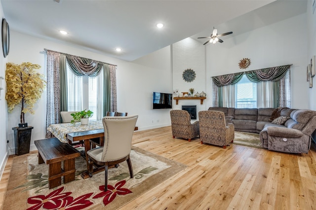 4017 Prickly Pear Ave, Aubrey, TX 76227 - dining space with light wood-style flooring, plenty of natural light, a ceiling fan, recessed lighting, and a large fireplace