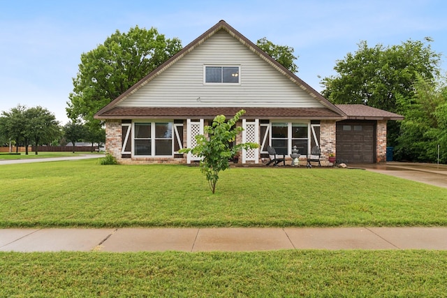 2318 Valleywood Dr, Carrollton, TX 75006 - view of front of house featuring a front yard, driveway, an attached garage, and brick siding