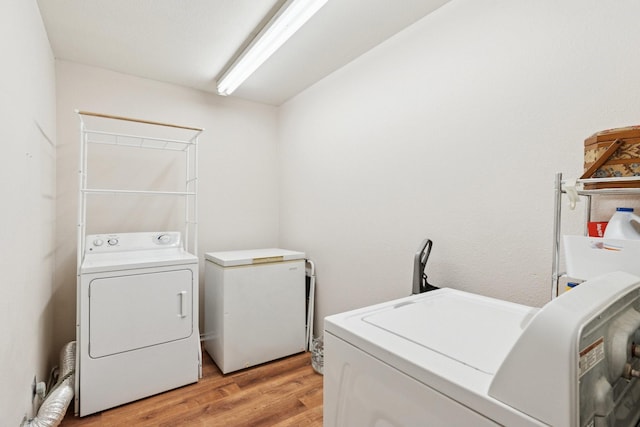2318 Valleywood Dr, Carrollton, TX 75006 - washroom with washer and dryer and light wood finished floors