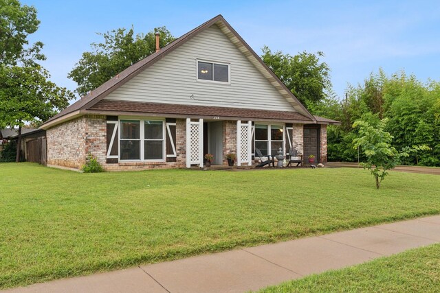 2318 Valleywood Dr, Carrollton, TX 75006 - view of front of house featuring a front yard and brick siding
