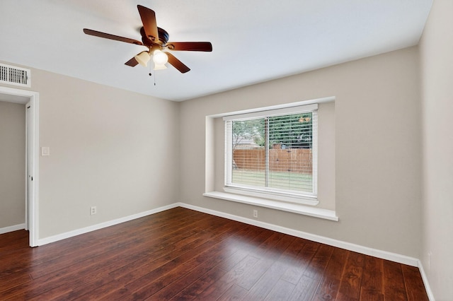 5644 Powers St, The Colony, TX 75056 - spare room with a ceiling fan and dark wood finished floors