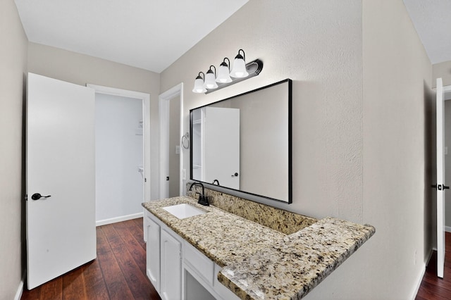 5644 Powers St, The Colony, TX 75056 - bathroom with hardwood / wood-style floors and vanity