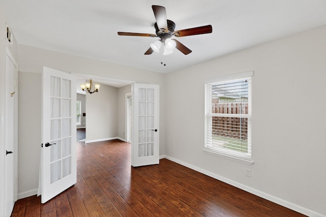 5644 Powers St, The Colony, TX 75056 - unfurnished room featuring french doors, a chandelier, dark wood-type flooring, and ceiling fan