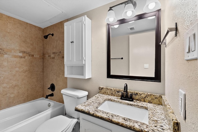 5644 Powers St, The Colony, TX 75056 - full bathroom with vanity, shower / bath combination, and a textured wall