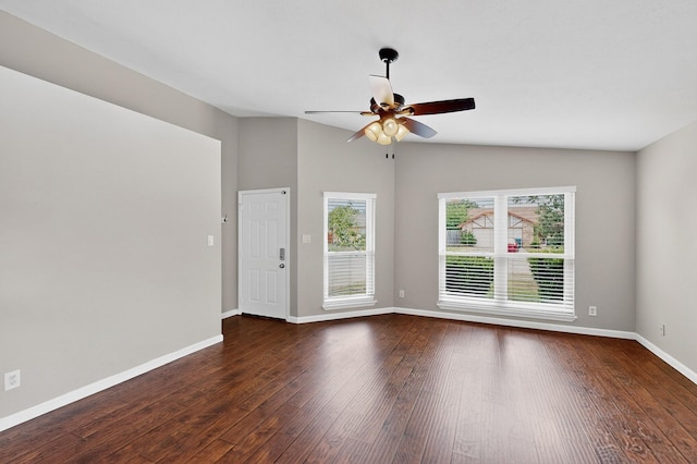 5644 Powers St, The Colony, TX 75056 - spare room with dark wood-style floors, plenty of natural light, a ceiling fan, and vaulted ceiling