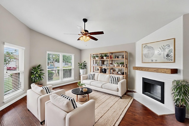 5644 Powers St, The Colony, TX 75056 - living room featuring lofted ceiling, ceiling fan, wood finished floors, and a fireplace